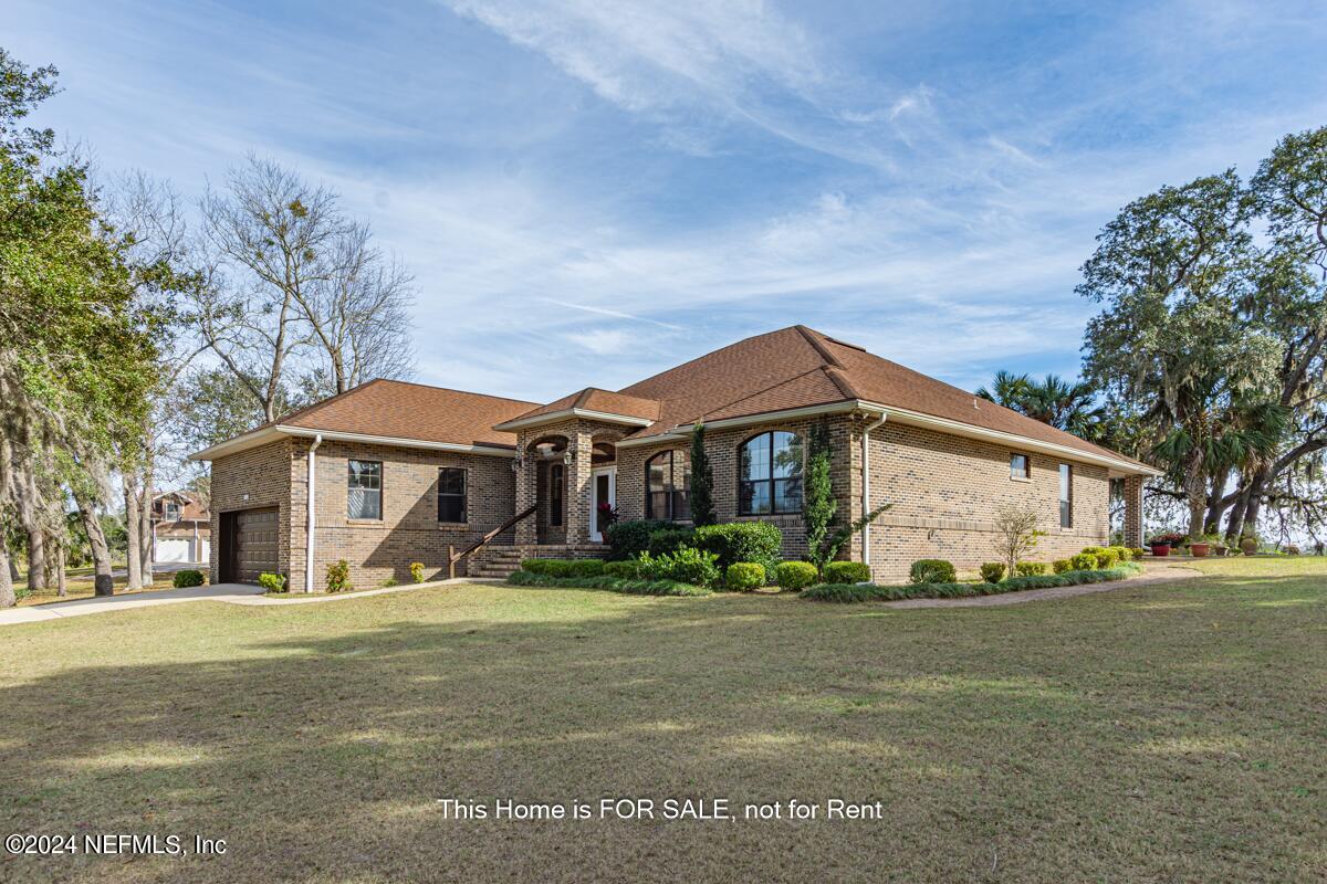 5745 Sheffield Road Jacksonville, FL 32226 - Photo 57 of 57 a front view of a house with a yard