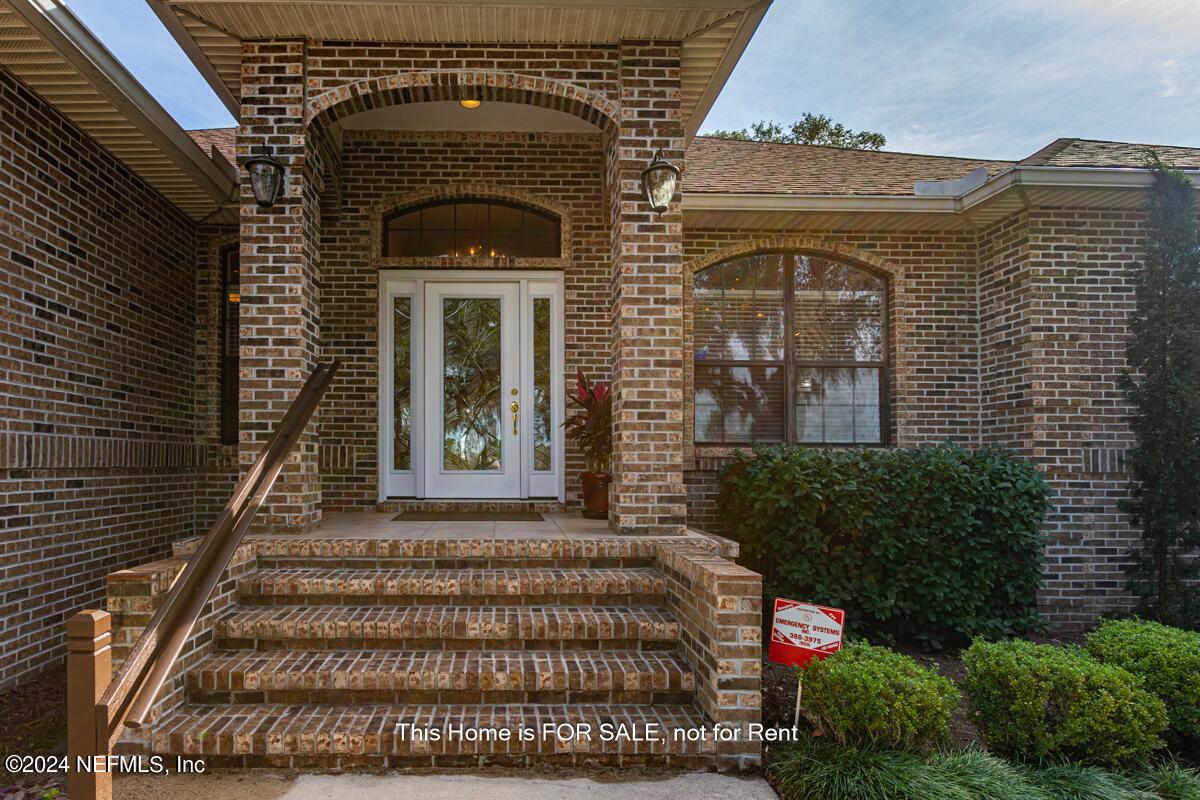 5745 Sheffield Road Jacksonville, FL 32226 - Photo 6 of 57 a front view of a house with plants