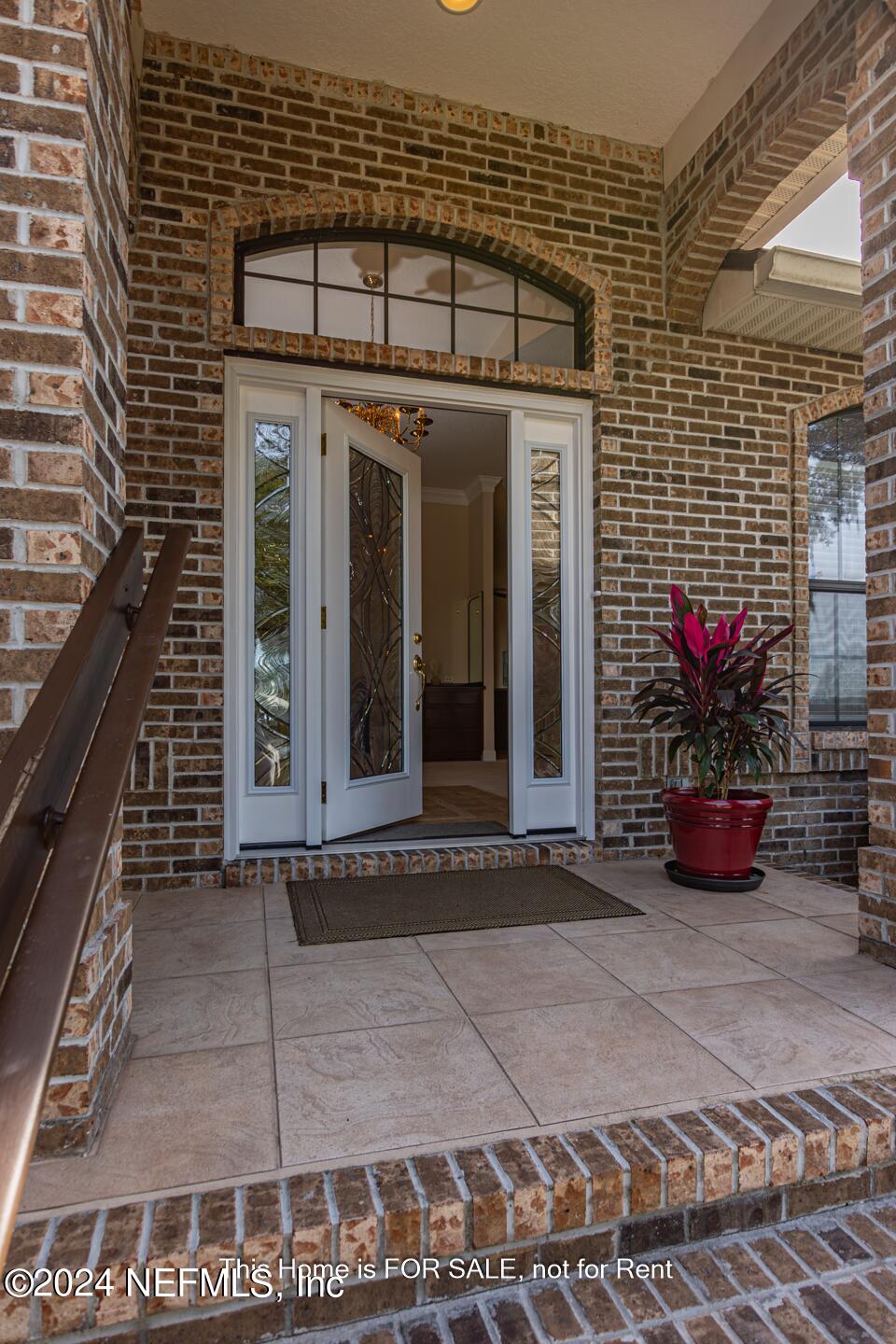 5745 Sheffield Road Jacksonville, FL 32226 - Photo 7 of 57 a view of a entryway door front of house