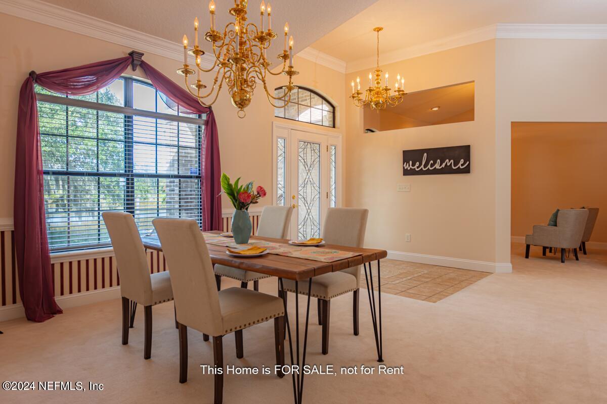 5745 Sheffield Road Jacksonville, FL 32226 - Photo 10 of 57 a view of a dining room with furniture window and outside view