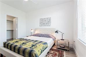 13130 Pond Springs Road, Unit 3214 Austin, TX 78729 - Photo 36 of 40 Relaxation awaits in this naturally illuminated bedroom with hardwood-style flooring and a convenient walk-in closet.