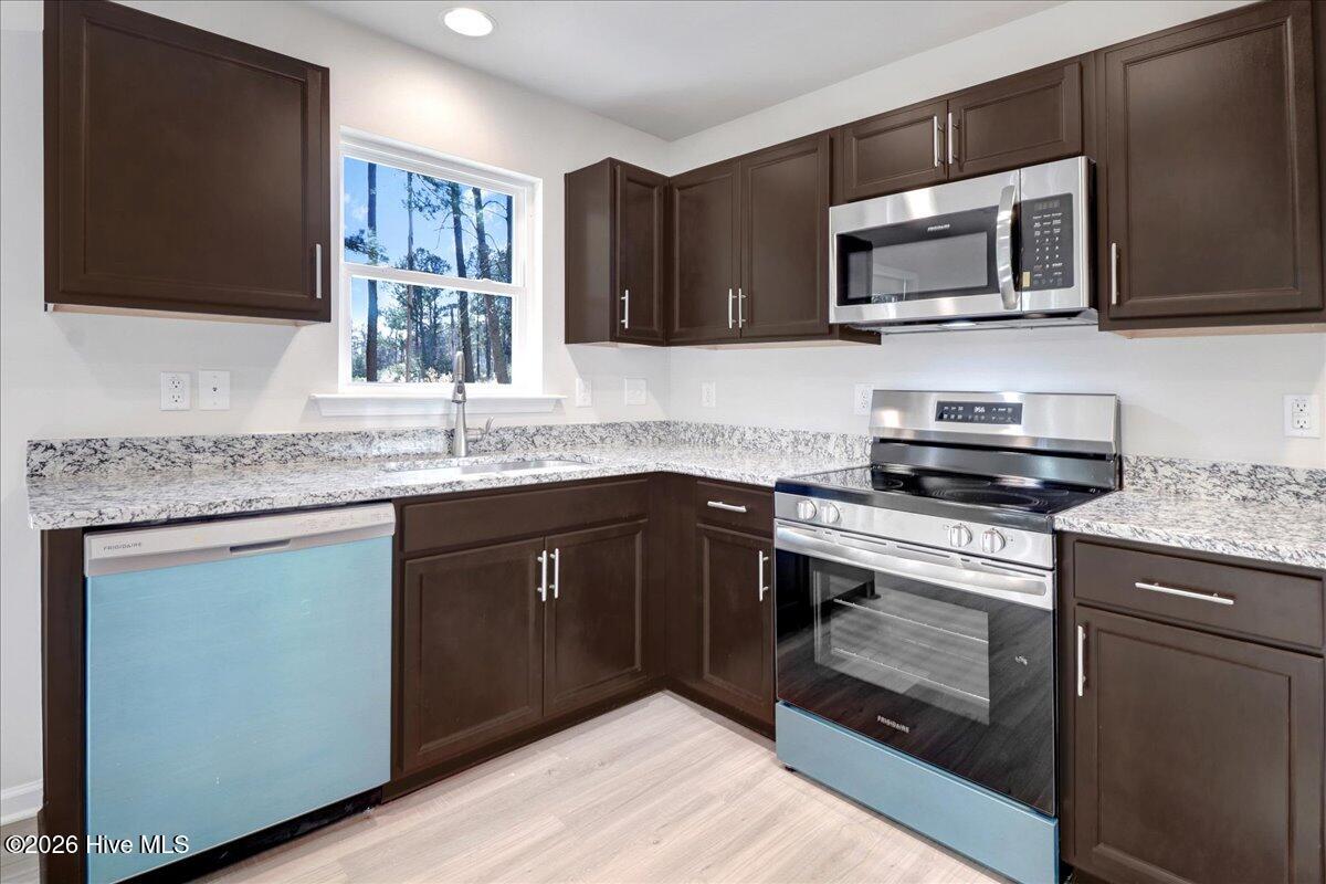 11379 Red Bud Road Castalia, NC 27816 - Photo 25 of 29 Stainless Steel appliances - the blue is the protective film
