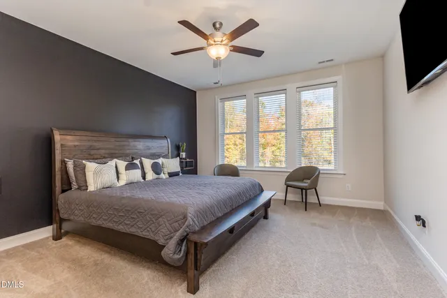 a view of a patio with table and chairs and potted plants