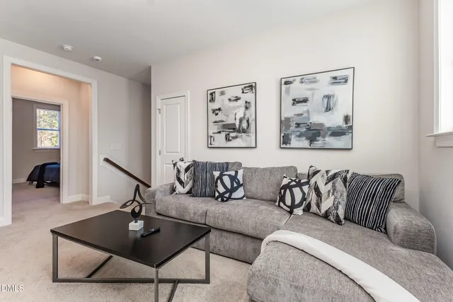 a front view of a house with a big yard and swimming pool