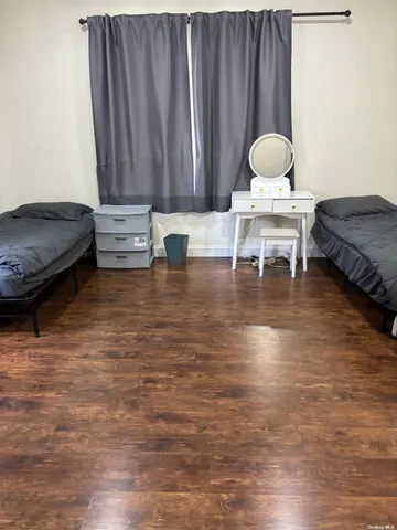 a living room with furniture and a chair