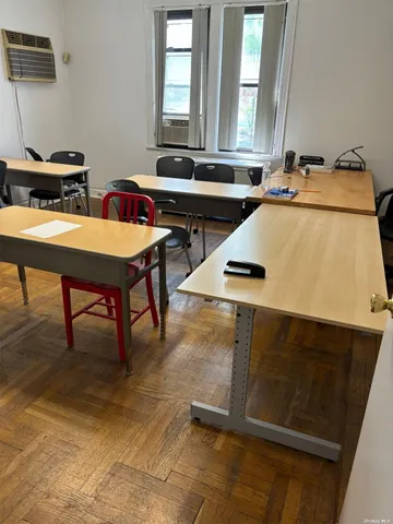 a kitchen with a table chairs and a window