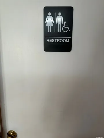 a sign that is on the side of a wall