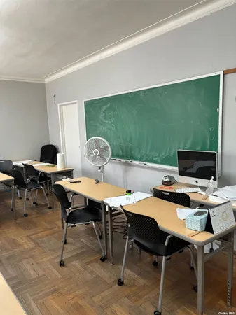 a view of a workspace with furniture