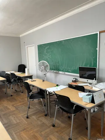 a view of a workspace with furniture