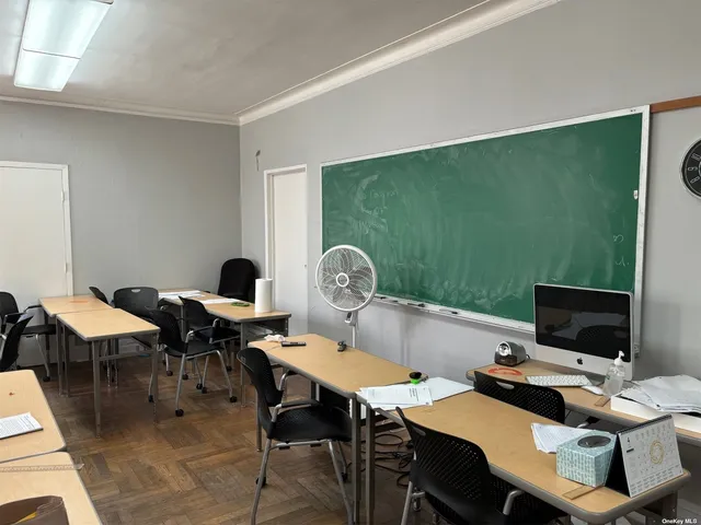 a view of a workspace with furniture
