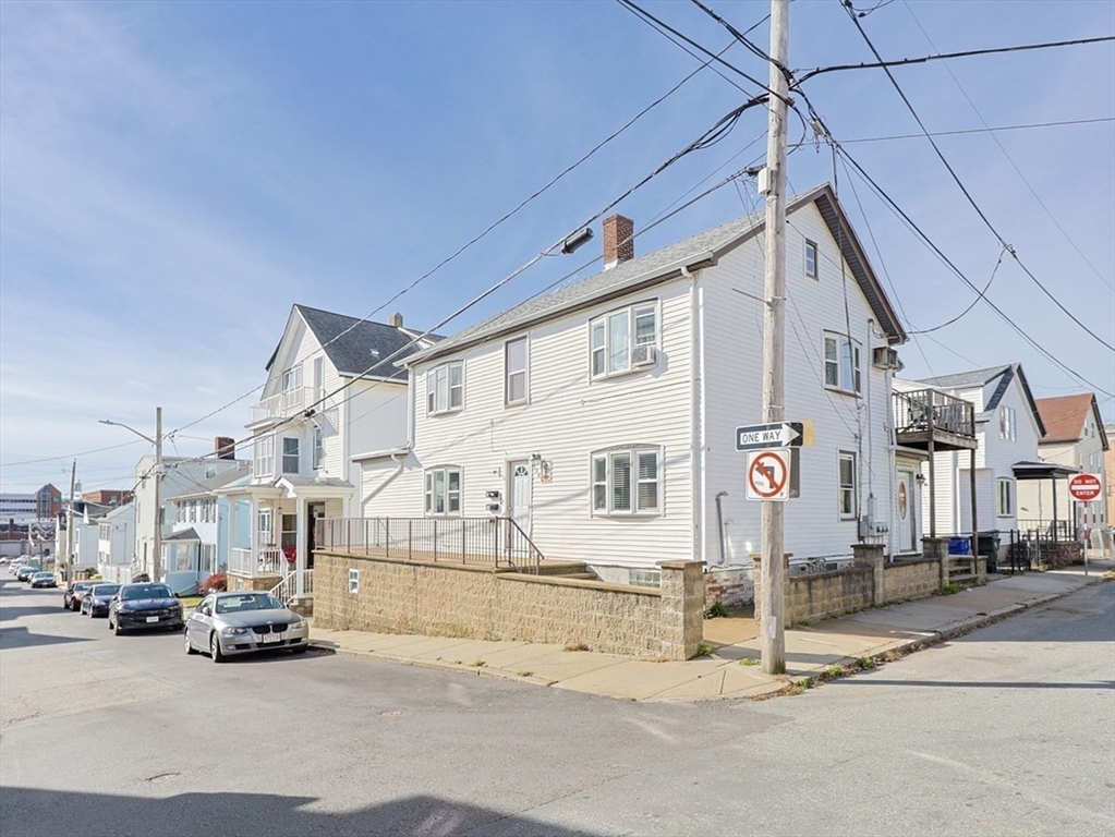 a view of a cars park in front of house