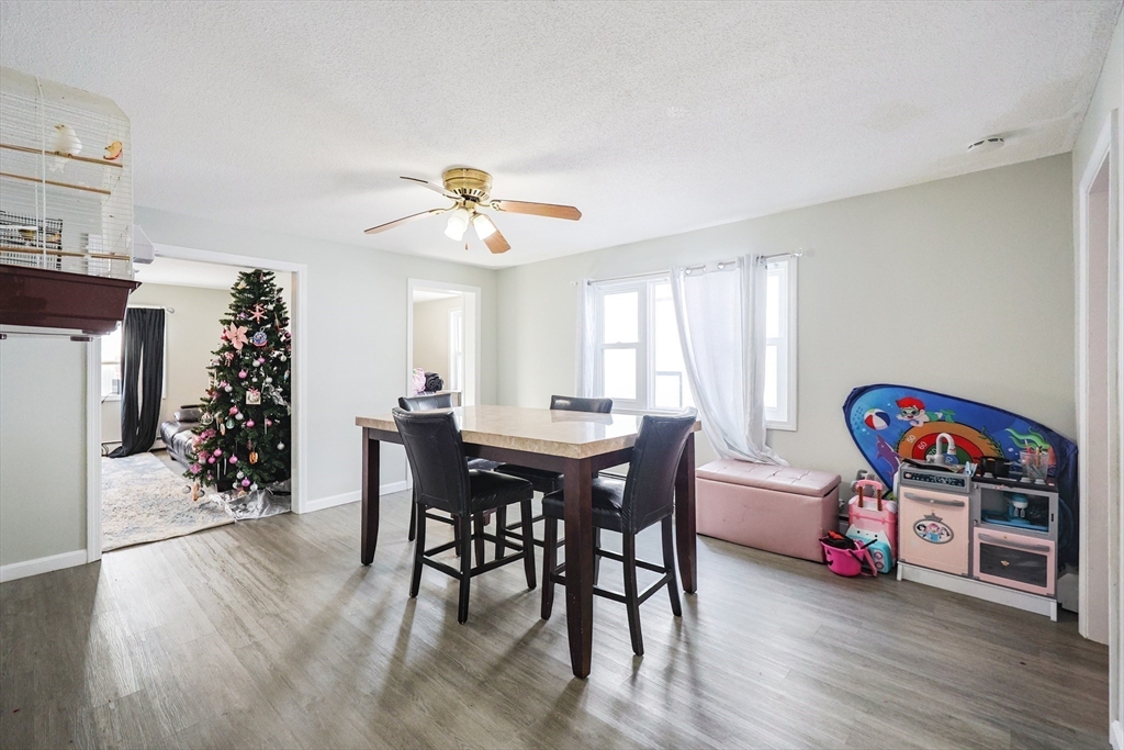 104 Oak Street Fall River, MA 02720 - Photo 14 of 37 a view of a dining room with furniture and wooden floor