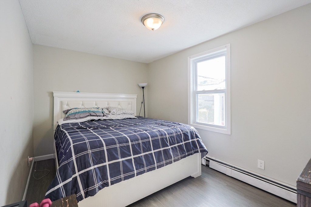 104 Oak Street Fall River, MA 02720 - Photo 19 of 37 a bedroom with a bed and window