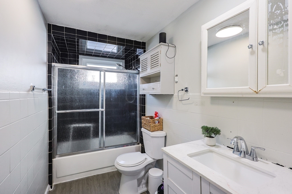104 Oak Street Fall River, MA 02720 - Photo 20 of 37 a bathroom with a sink toilet and shower