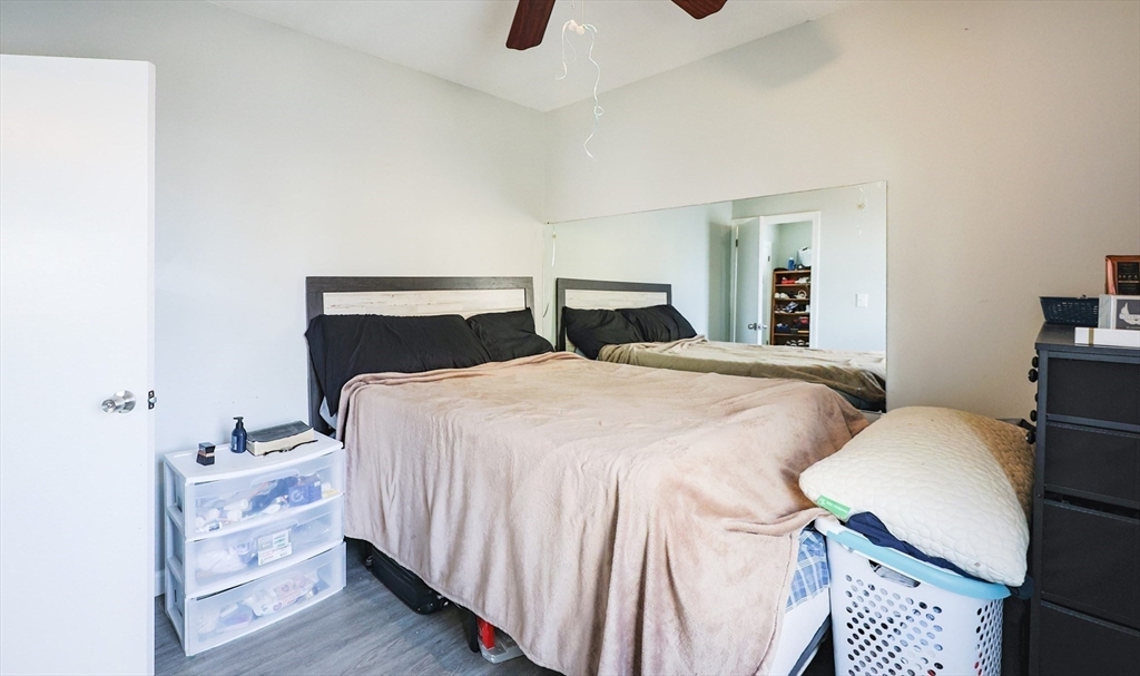 104 Oak Street Fall River, MA 02720 - Photo 23 of 37 a bedroom with a bed and a night stand