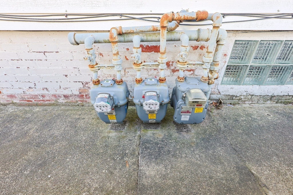 104 Oak Street Fall River, MA 02720 - Photo 36 of 37 a utility room with lot of items