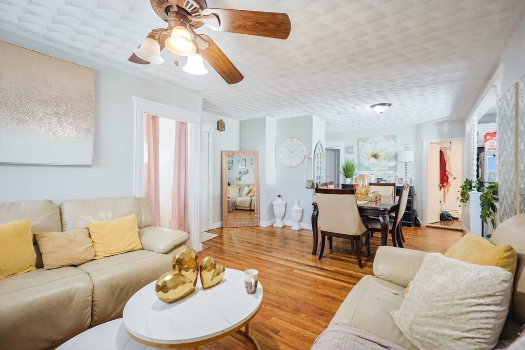104 Oak Street Fall River, MA 02720 - Photo 5 of 37 a living room with furniture and a wooden floor