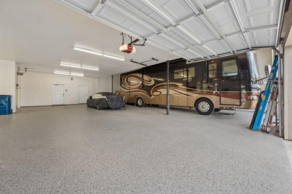 174 King Ranch Court Fort Worth, TX 76108 - Photo 37 of 40 Guardian Garage flooring over entire 9 car garage. Total Square Footage of Garage and Workshop area is 2,882 sq. ft.