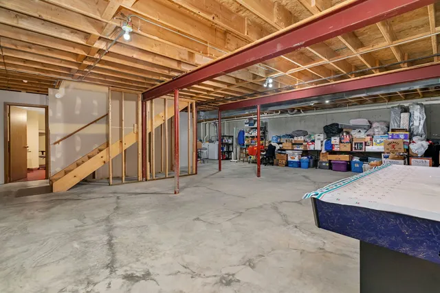 a view of a room with air conditioner duct and stairs