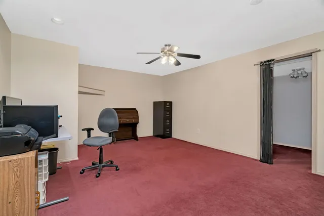 a workspace with a ceiling fan