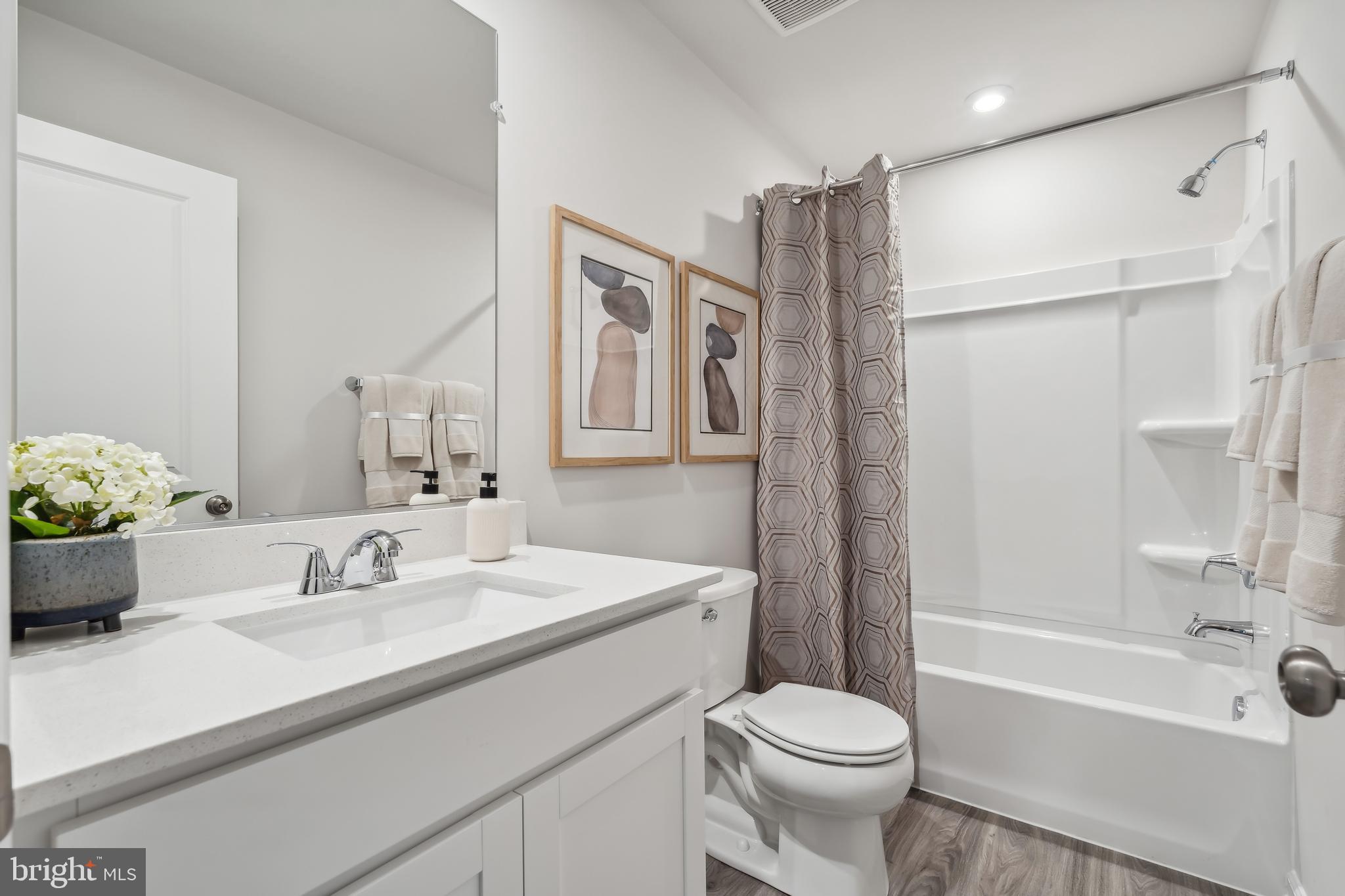 94 Tipton Road Charles Town, WV 25414 - Photo 26 of 29 a bathroom with a sink toilet and shower