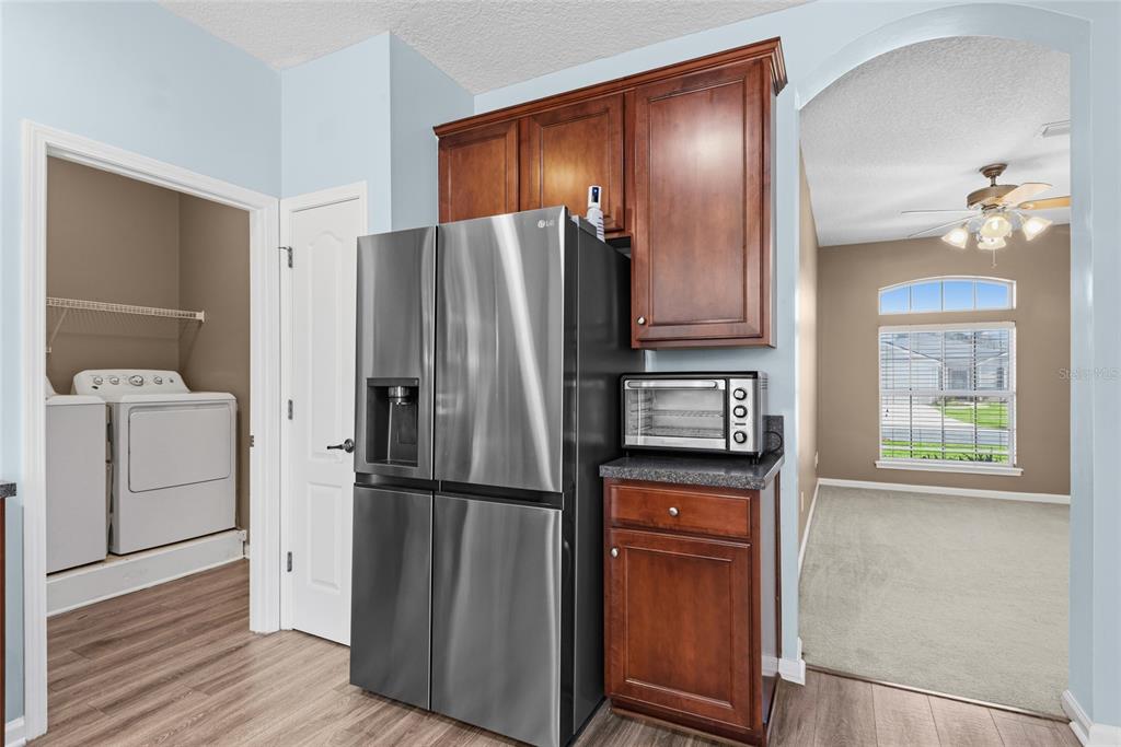 45095 Dutton Way Callahan, FL 32011 - Photo 13 of 36 a kitchen with stainless steel appliances granite countertop a refrigerator and a sink