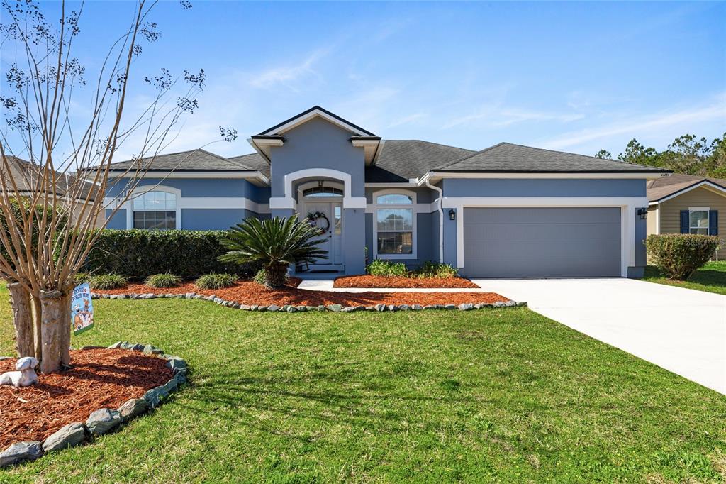 45095 Dutton Way Callahan, FL 32011 - Photo 2 of 36 a front view of a house with a yard
