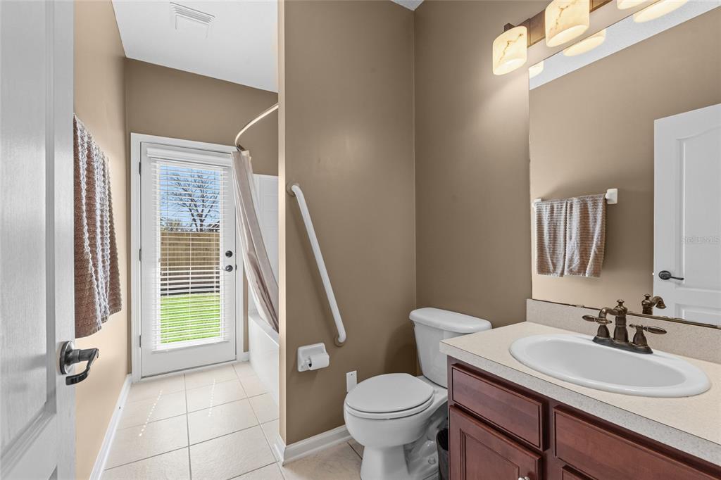 45095 Dutton Way Callahan, FL 32011 - Photo 31 of 36 a bathroom with a sink toilet and a mirror
