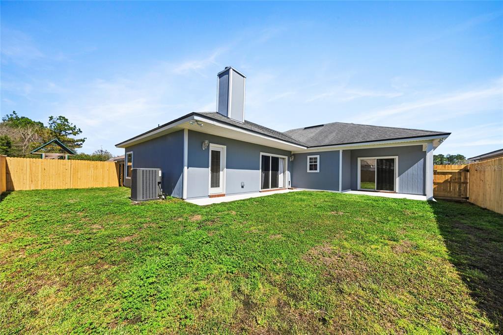 45095 Dutton Way Callahan, FL 32011 - Photo 35 of 36 a view of a house with yard and tree s