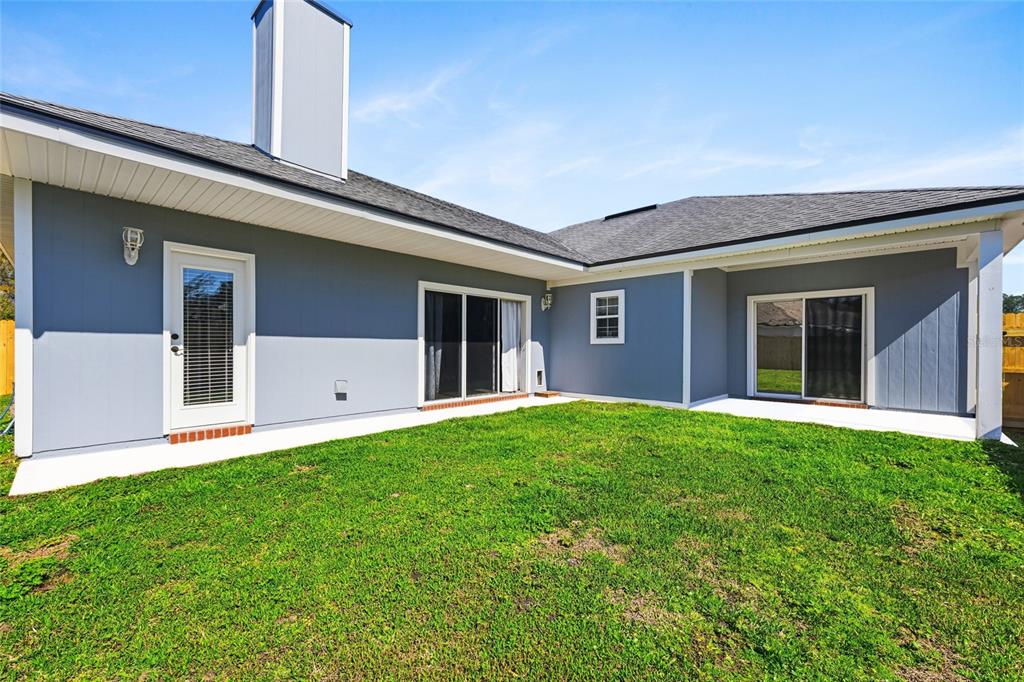 45095 Dutton Way Callahan, FL 32011 - Photo 36 of 36 a front view of a house with a yard and garage