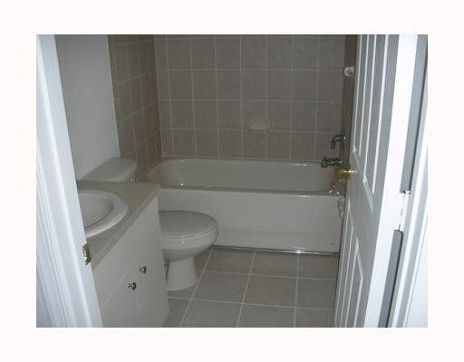2928 Hidden Hills Road, Unit 1403 West Palm Beach, FL 33411 - Photo 3 of 13 a bathroom with a sink and a toilet