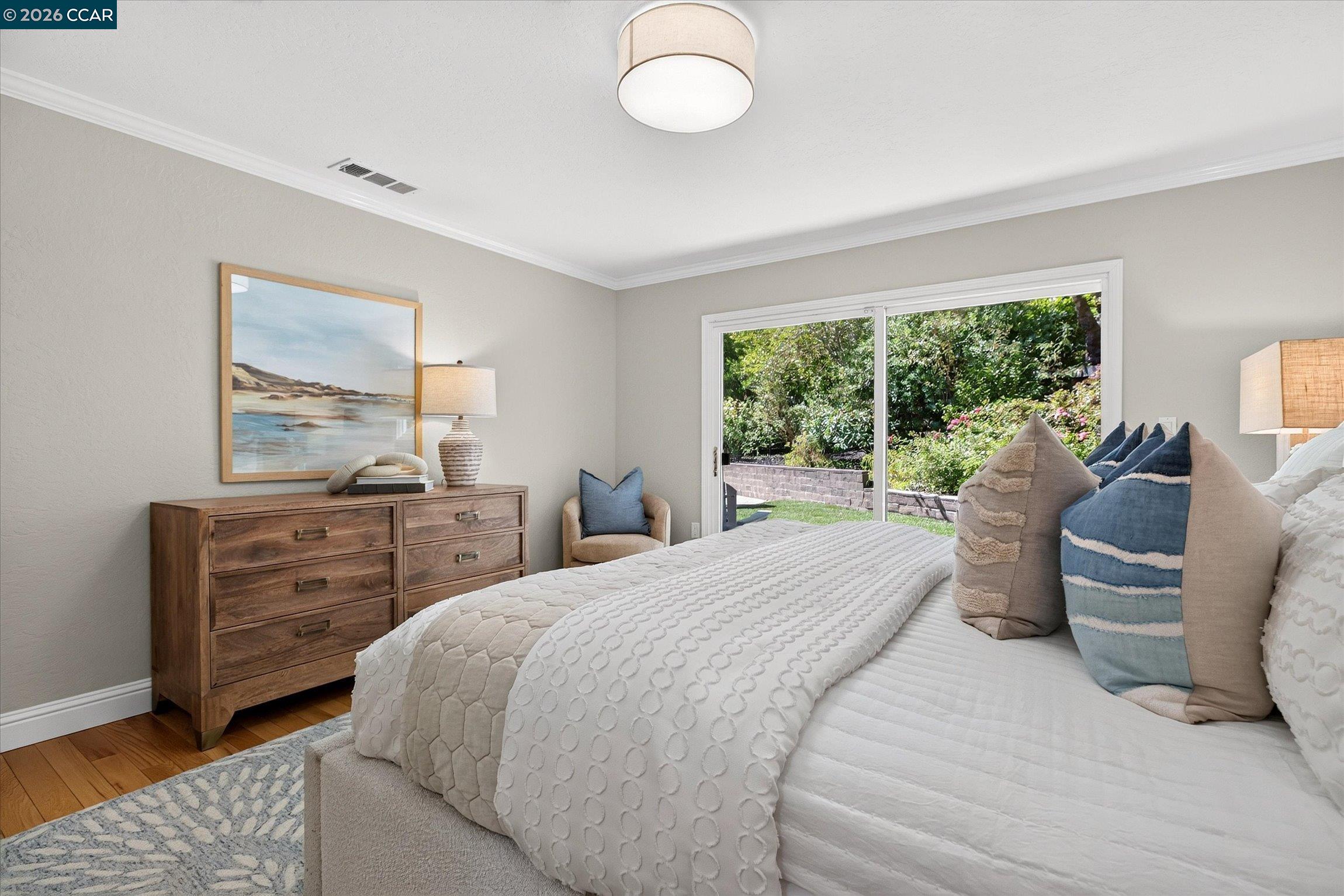 3365 St Marys Road Lafayette, CA 94549 - Photo 14 of 27 a bedroom with a bed and wooden floor