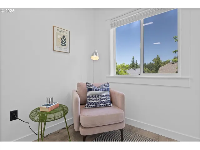 a bedroom with furniture and a window