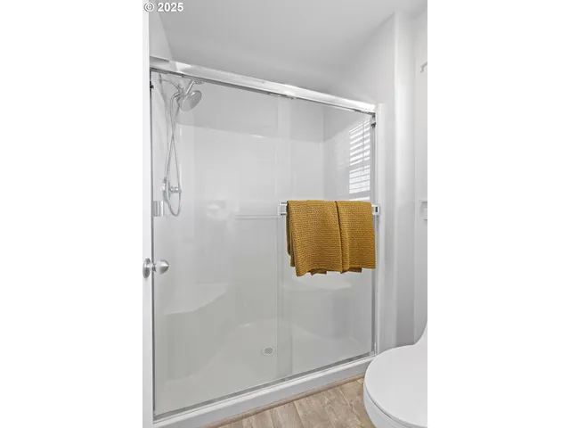 a bathroom with a shower and toilet