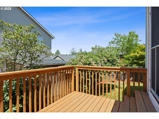 a view of balcony with wooden floor