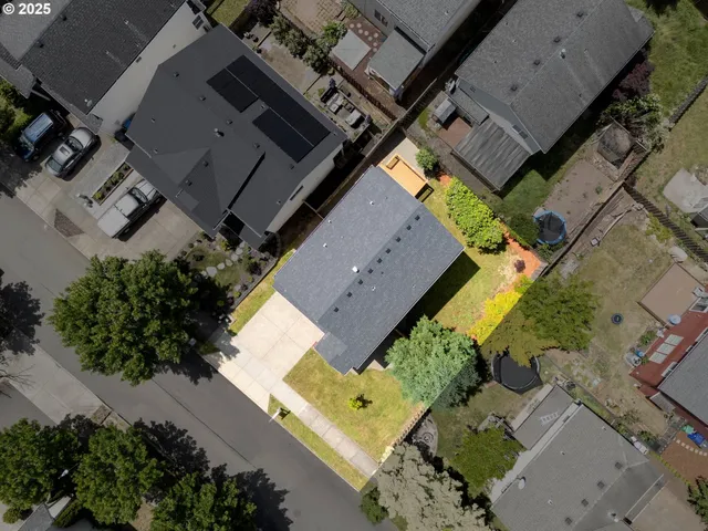an aerial view of house with a yard