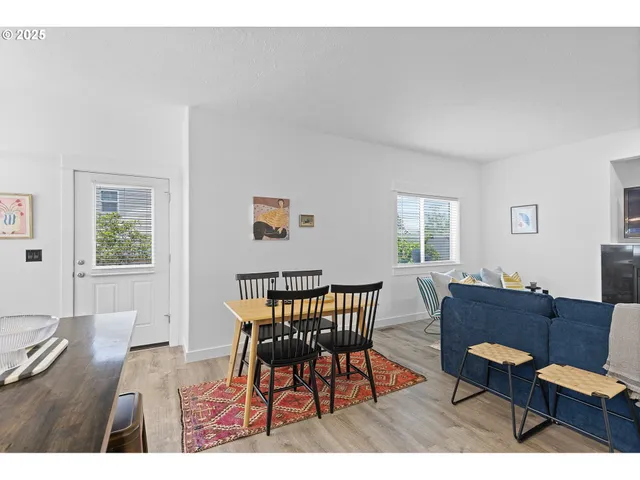 a workspace with furniture window and wooden floor