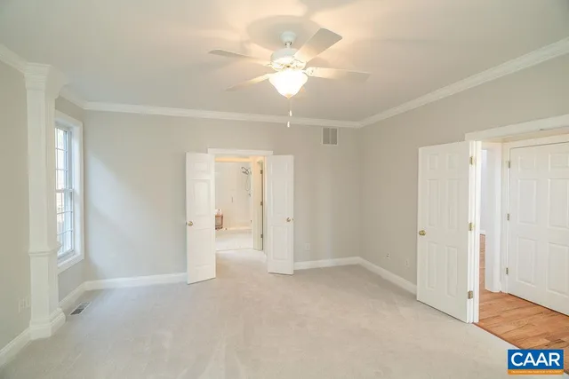 a bathroom with a shower a sink and a mirror