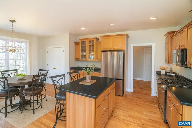 a kitchen with granite countertop a sink and a window
