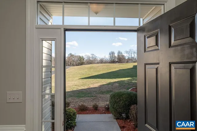 a view of a livingroom with wooden floor and a window