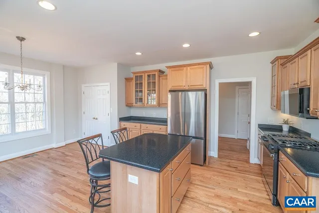 a kitchen with granite countertop a stove and a sink