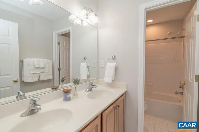 a bathroom with a shower and a bath tub