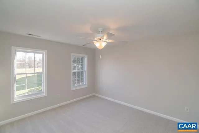 a view of a room with wooden walls