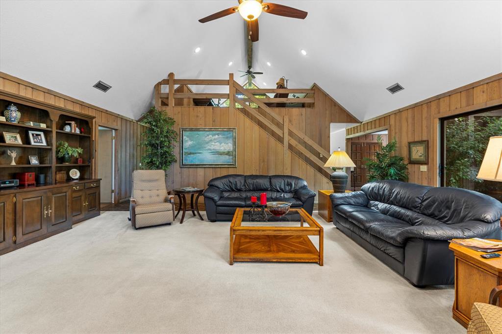 1200 North Acres Circle Springhill, LA 71075 - Photo 12 of 40 a living room with furniture and a chandelier