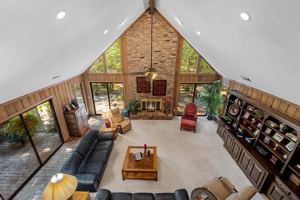 1200 North Acres Circle Springhill, LA 71075 - Photo 16 of 40 a living room with furniture fireplace and a large window