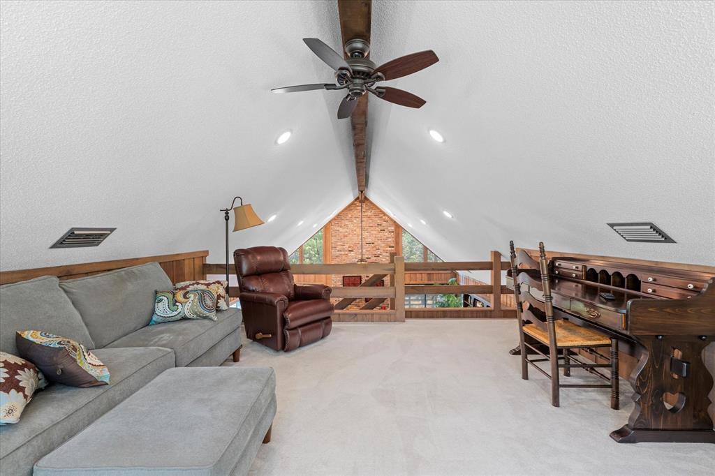 1200 North Acres Circle Springhill, LA 71075 - Photo 17 of 40 a living room with furniture a window and a chandelier