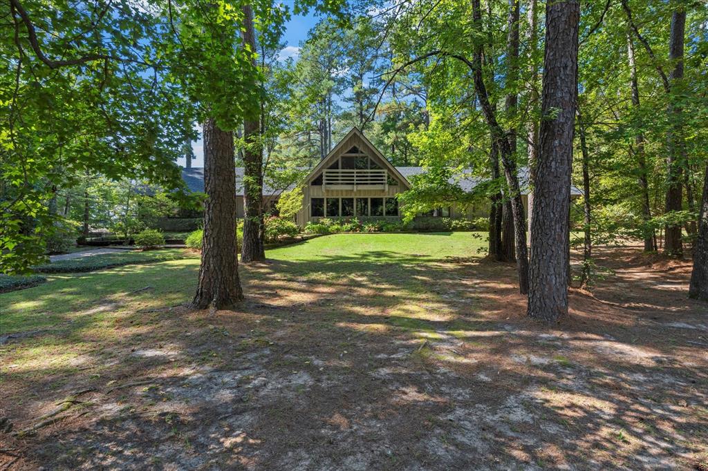 1200 North Acres Circle Springhill, LA 71075 - Photo 2 of 40 a dirt road with trees in the background
