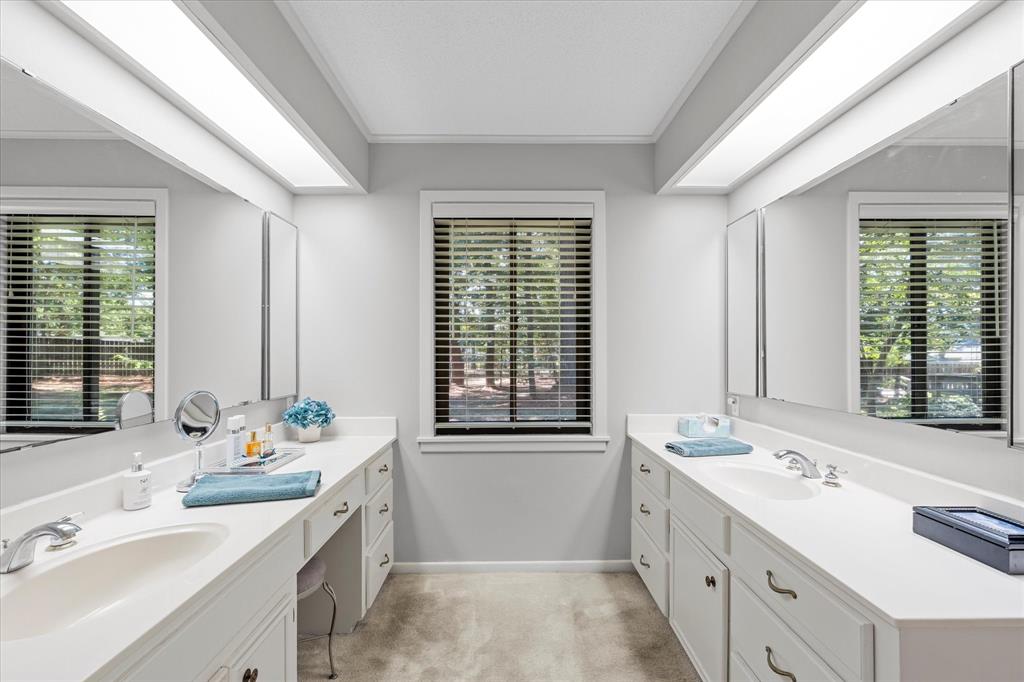 1200 North Acres Circle Springhill, LA 71075 - Photo 27 of 40 a bathroom with a double vanity sink large mirror and a bathtub
