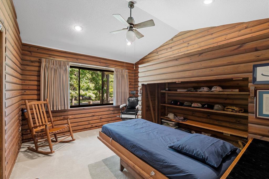 1200 North Acres Circle Springhill, LA 71075 - Photo 28 of 40 a room with furniture and a chandelier