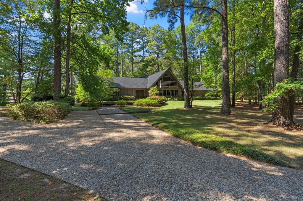 1200 North Acres Circle Springhill, LA 71075 - Photo 3 of 40 a view of a park with plants and trees